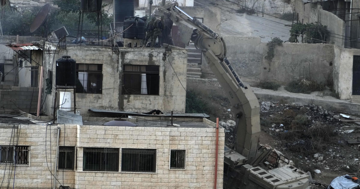 Israeli soldiers were seen pushing bodies from rooftops during a raid in the occupied West Bank